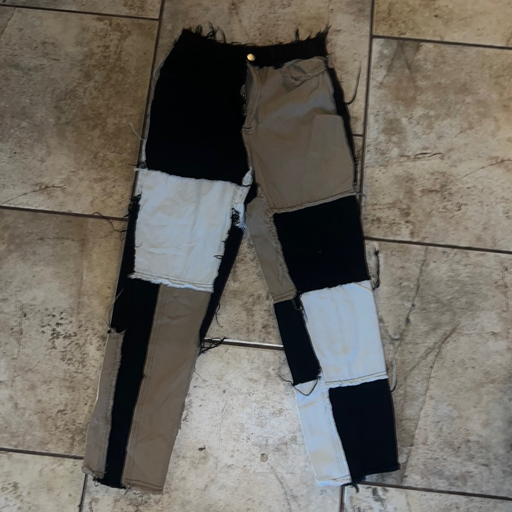 Brown , tan , cream and black pants .